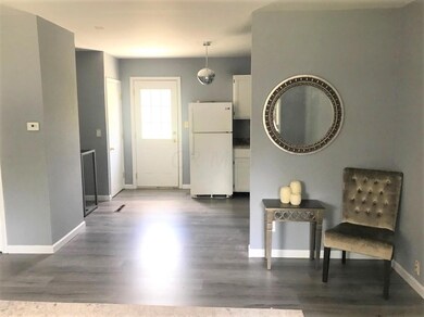 Front door into kitchen view