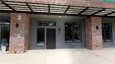 Doorway to property with brick siding