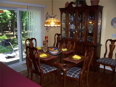 Formal dining room has slider door to backyard. Ha