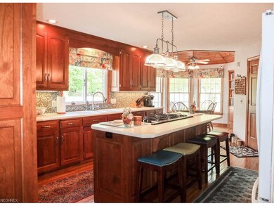 Kitchen offers beautiful cherry cabinets, new back