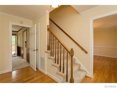 Welcoming Foyer with Hardwood Floors