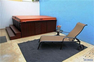 Front courtyard private above ground spa.