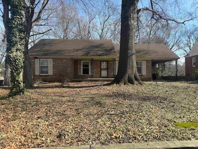 View of front of property featuring a carport
