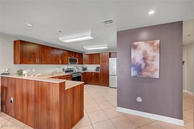 Kitchen featuring stainless steel appliances, ligh