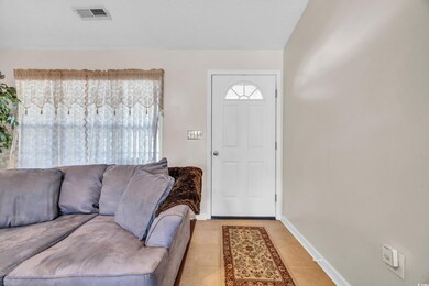 Entryway featuring light tile patterned floors and