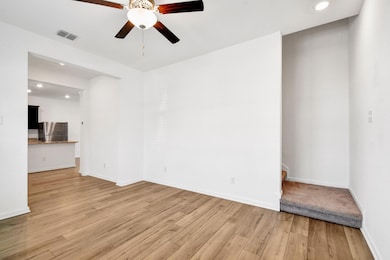 Spare room with recessed lighting, light wood-type flooring, and ceiling fan
