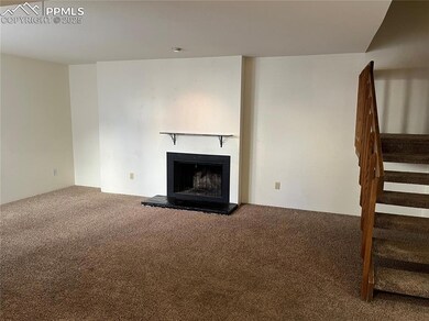 Unfurnished living room with carpet floors