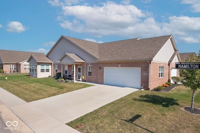 wide driveway leading to oversized 2 car garage