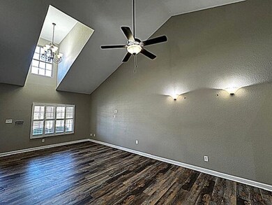 LIVING ROOM WITH VAULTED CEILING