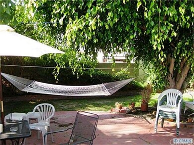 relax on the patio under the beautiful shade tree.
