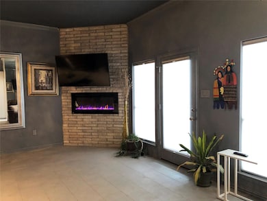 Living room with a brick fireplace