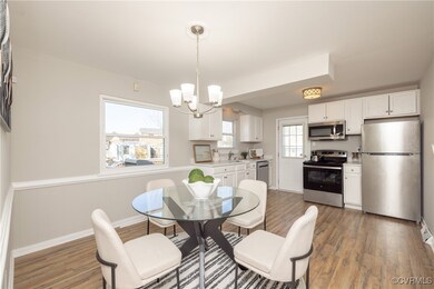 Dining space featuring a chandelier, wainscoting,