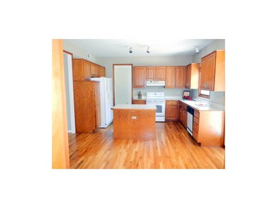 Lots of cabinets and pantry in spacious kitchen.