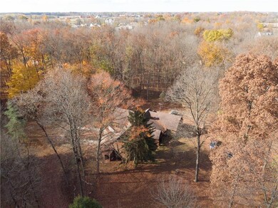 Aerial view of the home. Spring & summer this property is a lush forest!