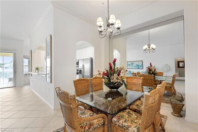 Dining space featuring crown molding, a notable ch