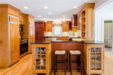 Granite and quartz countertops, breakfast bar, and