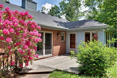 Deck off Kitchen and Sunroom bordered by spring color