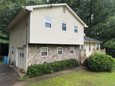 View of front of property featuring stone siding, 