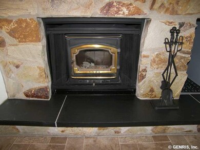 Foyer. Lopi woodstove insert means nice, even heat