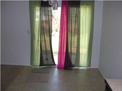 Dining Area w/ Tile Floors and Sliding Door to Pat