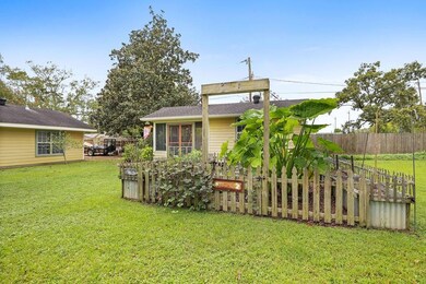 Outdoor screen room/storage with garden