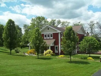 Exterior Front. Classic and simple landscaping is 