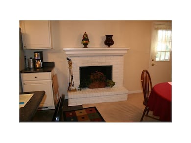 Fireplace. Wood fireplace in dining room.  Would also make a nice hearth room/family room.