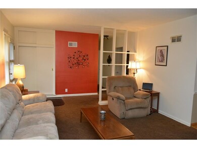 Here's the living room into the entry which leads to the bedrooms and the back entry.