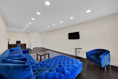 Couch, desk, wall mounted TV are all included.