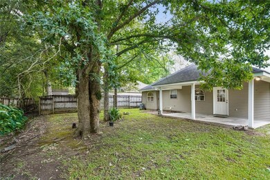 Backyard. Home has covered one-car carport or use
