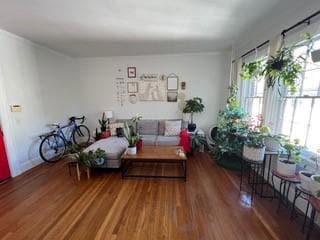 Living room with dark hardwood / wood-style floors