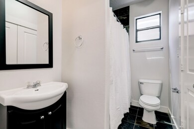 Downstairs bedroom offers ample space and features