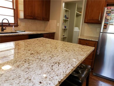 Large granite slab for serving and guest seating. 