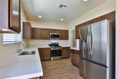Kitchen featuring appliances with stainless steel