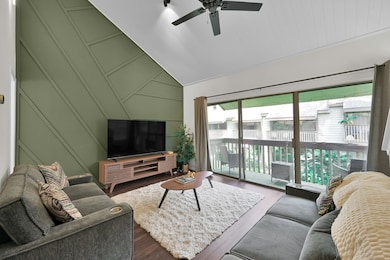 The living room features vaulted ceilings, excepti