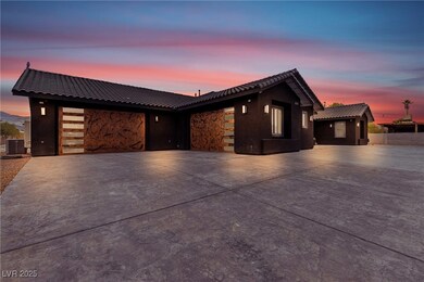 View of front of house with driveway, a tiled roof