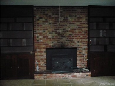 Living Room. Wood burning stove and built-ins in t