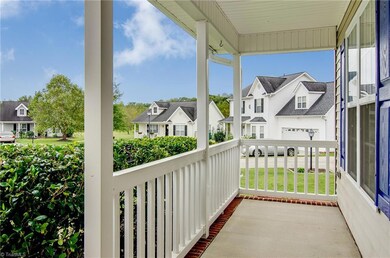 Relaxing front porch just waiting for your rocking chairs.