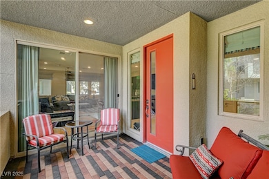 Entrance to property featuring stucco siding, visi
