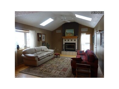 Great room with gas fireplace, skylights