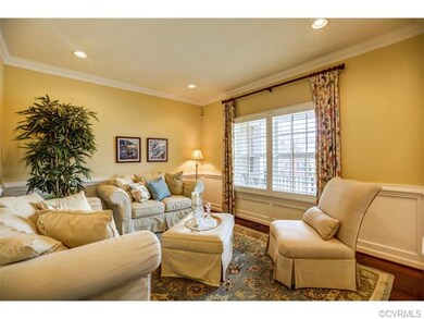 Formal living room with water view and wainscoting