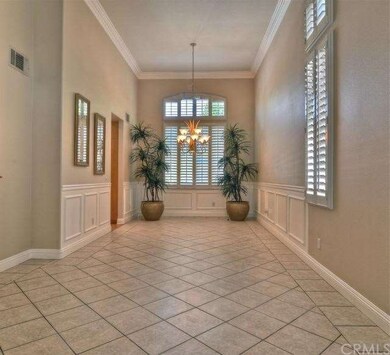Elegant Dining Room features crown moulding, upgra