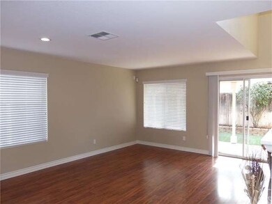 Standing inside front door you see the Family Room, Fireplace mantle showing on right side of picture.  Two tone paint, elegant new baseboards, new 2