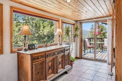 Sunroom featuring wood ceiling
