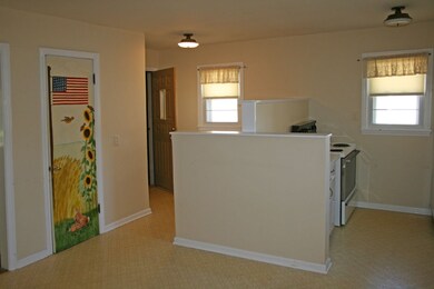 Kitchen has lots of cupboards and counter space.