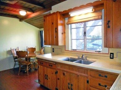 Charming eat-in kitchen with endless cabinetry.  L