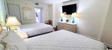Bedroom with visible vents and baseboards