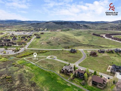 Prime golf-course exposure from Lot 5 with rolling fairways and mountain vistas defining the backdrop. Lot lines shown are approximate.