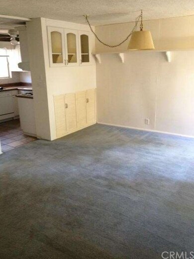 Spacious Living/Dining Room with Built-Ins and Sli
