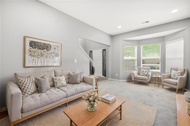 Living room featuring baseboards, visible vents, a